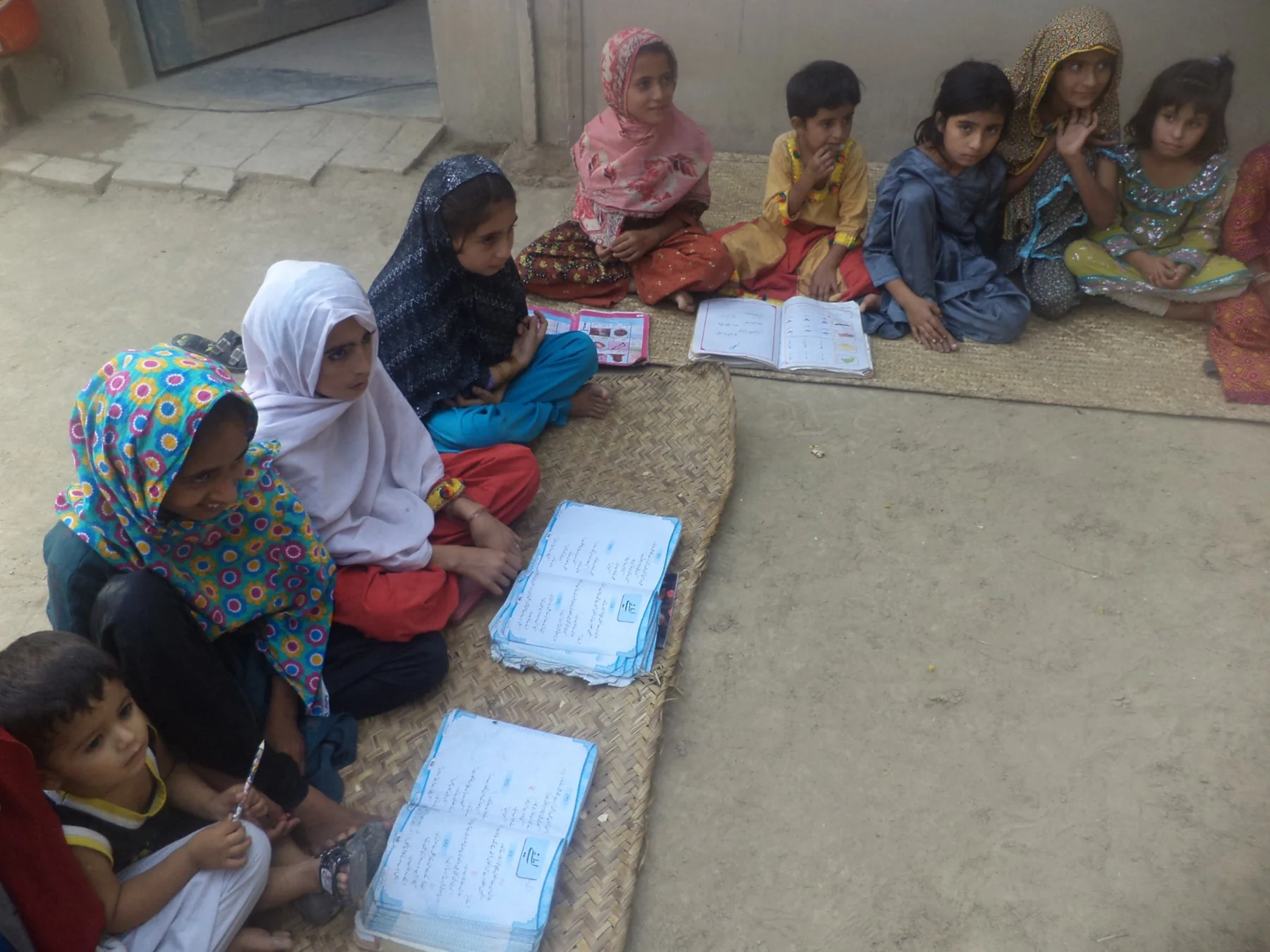 Girls and children participating in community education